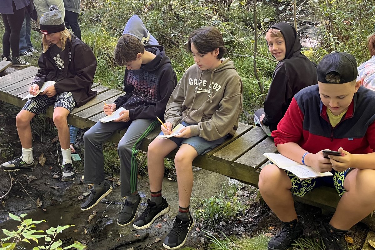 Students taking notes during Nature Journaling course